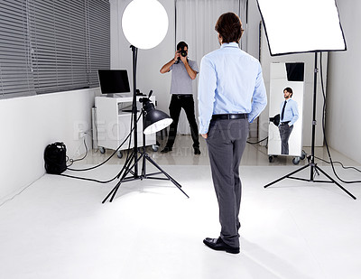 Buy stock photo Photographer, model and lighting with equipment in studio for career, behind the scenes or electronics. Photography, person or working with cameras, flash and shooting gear for photoshoot or passion