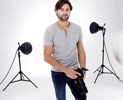 Buy stock photo Photographer, confidence or lighting with equipment in studio for career, behind the scenes or camera. Photography, guy and portrait with electronics, flash or shooting gear for photoshoot or passion