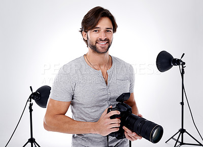 Buy stock photo Photography, portrait and happy with camera in studio for career, behind the scenes and backpack. Photographer, person or smile with equipment, mockup space or shooting gear for photoshoot or passion