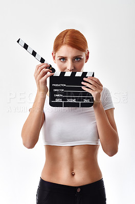 Buy stock photo Eyes, clapperboard and portrait of woman on a white background for film, movies and cinema industry. Filmmaking, director and isolated person with board for cinematography or production in studio