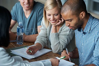 Buy stock photo Education, university and students in studying together for learning, share ideas and research for project. Paper, writing and academic discussion for assignment on campus, diversity and scholarship