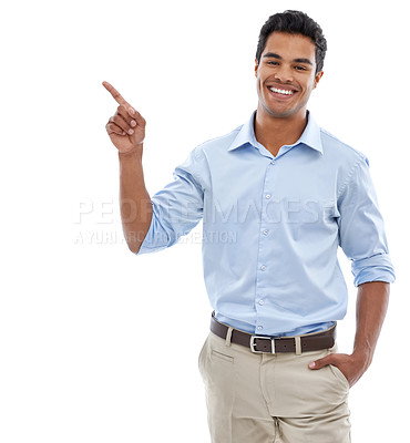 Buy stock photo studio shot of a handsome young man pointing at copyspace