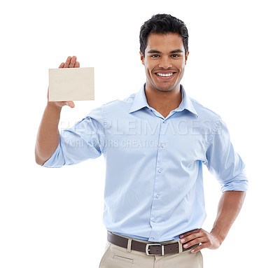 Buy stock photo Studio shot of a young man holding a blank card for copyspace isolated on white