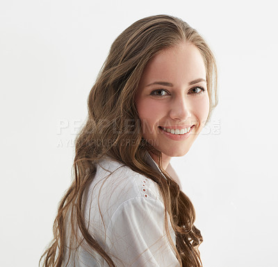Buy stock photo Woman, hair and smile in portrait for beauty, natural cosmetics and salon hairstyle with waves on white background. Self care, wellness and happy for haircare in studio, texture and growth with shine