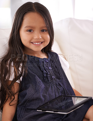 Buy stock photo Portrait, happy girl and child with tablet on sofa for entertainment, internet or social media at home. Face of female person or little kid with smile, technology or ebook in living room at house