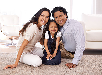 Buy stock photo Cropped portrait of an affectionate young family at home