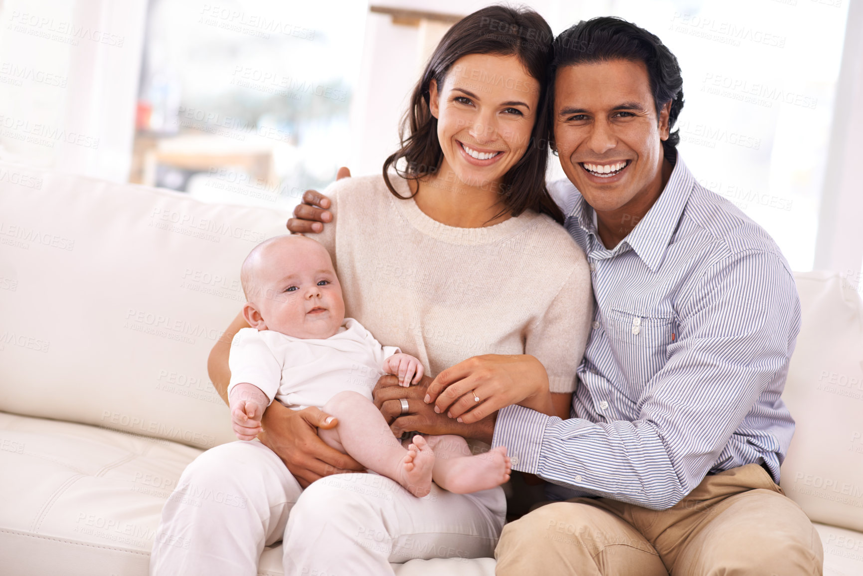 Buy stock photo Happy family, portrait and baby on sofa for bonding, holiday weekend or support together at home. Father and mother smile with young little child, kid or newborn toddler on living room couch at house