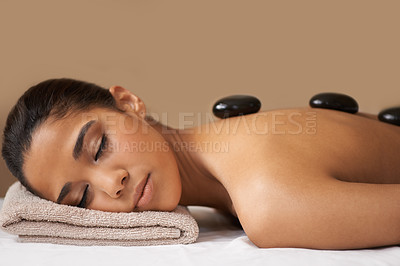Buy stock photo Woman, rock or back massage in spa to relax for zen, sleeping or wellness physical therapy in resort. Relaxed girl client in beauty salon to exfoliate for luxury skincare healing treatment or detox