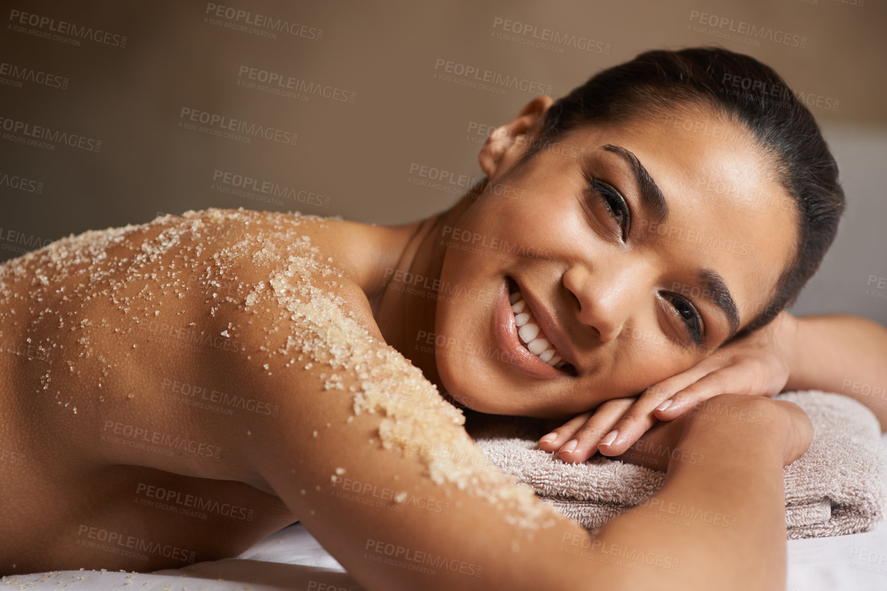 Buy stock photo Portrait of happy girl, body scrub or massage to relax for zen resting or wellness physical therapy in spa. Smile, face or female client in salon to exfoliate for luxury skincare treatment or beauty