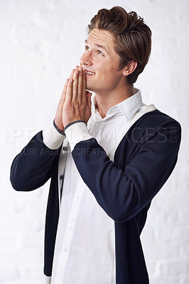 Buy stock photo Man is praying, happy and gratitude for worship or religion, spiritual and respect with belief on white background. Mindfulness, wellness and faith in God, hope and help with thank you in studio