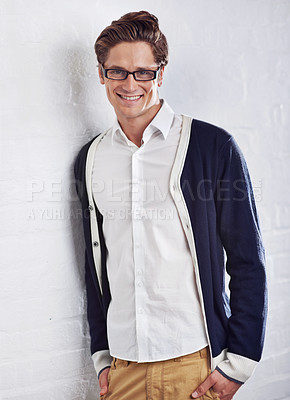 Buy stock photo Fashion, glasses and portrait of happy man with confidence, smile or positive attitude on wall background. Style, face and casual male person in comfortable clothing, good mood or cool outfit choice