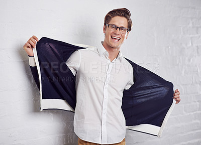 Buy stock photo Man, portrait and smile with confidence or fashion on wall background or cool, happiness or style. University student, face and glasses or jacket as relaxing or pride in Canada, excited or expression