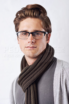 Buy stock photo Glasses, style and portrait of man by wall with casual, cool and trendy outfit for confidence. Serious, handsome and young male person with spectacles and fashion standing by white brick background.