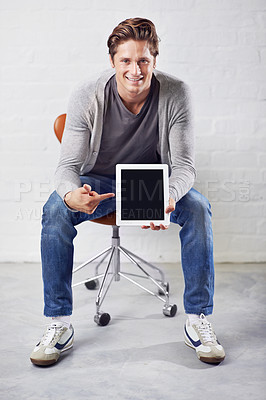 Buy stock photo Happy man, portrait and chair with tablet screen for advertising or marketing on a white studio background. Smile, young or handsome male person pointing or showing technology display or mockup space