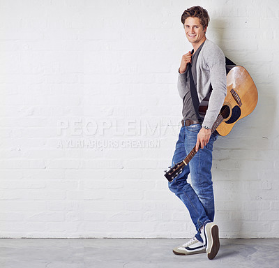Buy stock photo A young man with a guitar