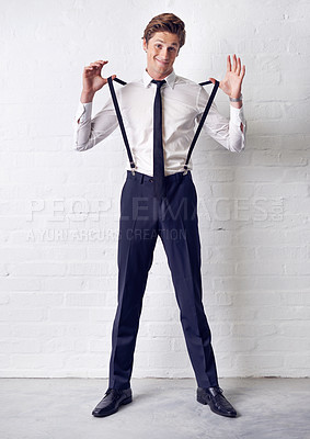 Buy stock photo Man, portrait and fashion with comedy, confidence and suit with trendy and stylish clothes. Hipster, male person and wall with event, classic and fancy suspenders with dressing formal for celebration
