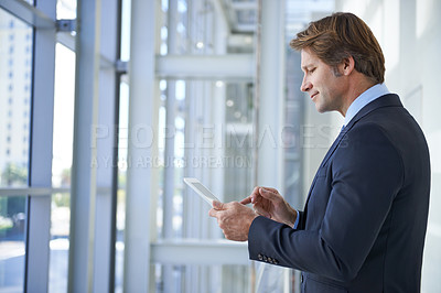 Buy stock photo Tablet, office and business man by window for social networking, typing email and connection. Corporate worker, professional and person on digital technology for online search, website and internet