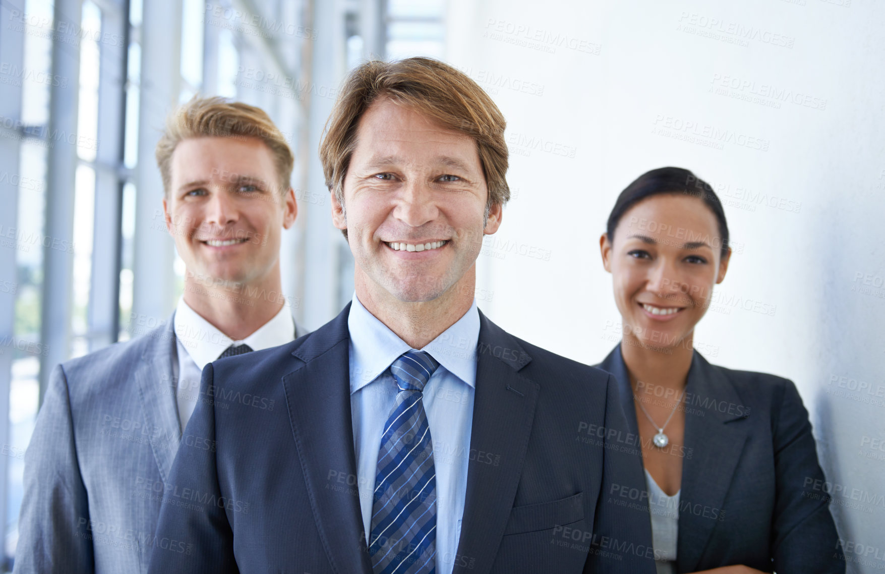 Buy stock photo Teamwork, office and portrait of happy business people for pride, confidence and collaboration in hallway. Corporate lawyers, professional and men and woman for partnership, leadership and about us