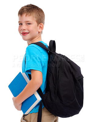 Buy stock photo Boy child, studio portrait and backpack with book, smile and happiness for education goal by white background. Isolated student kid, learning and school with smile, happy and ready to start reading