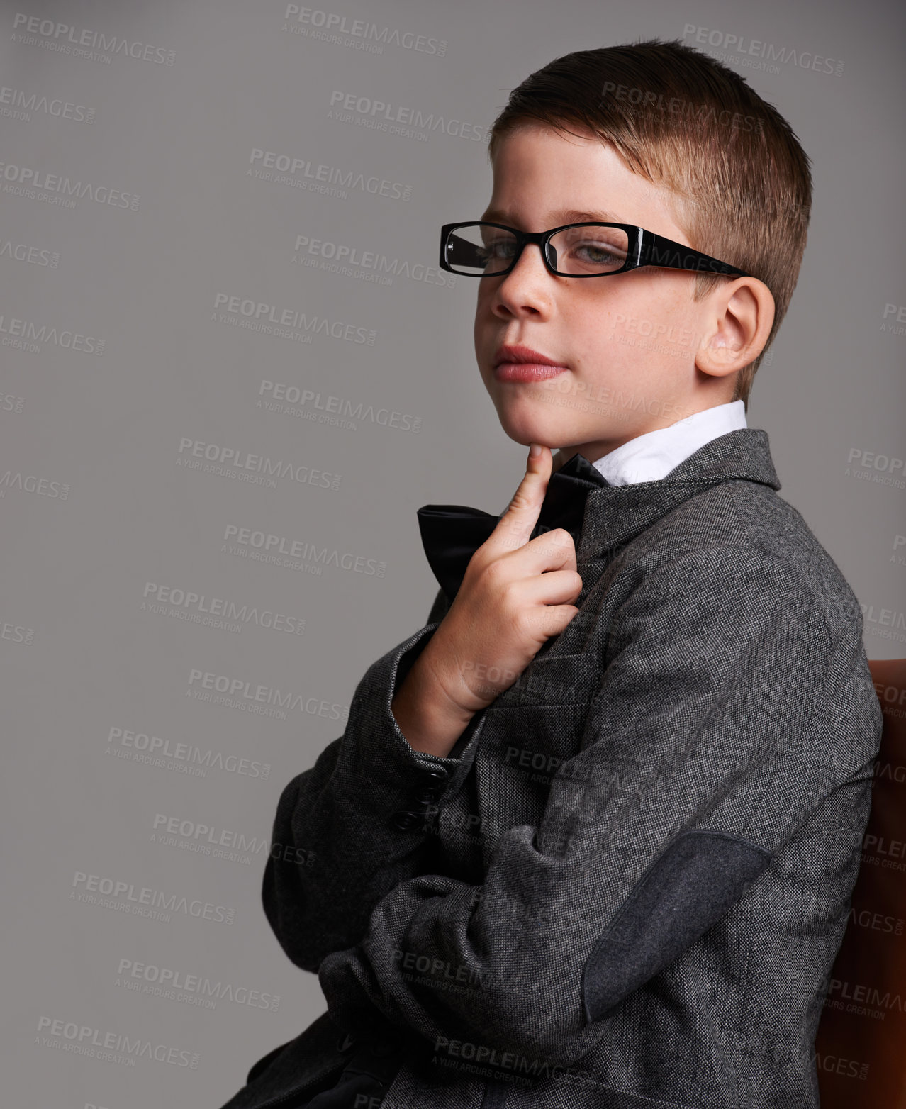 Buy stock photo Studio shot of a cute young boy wearing a retro suit against a grey background