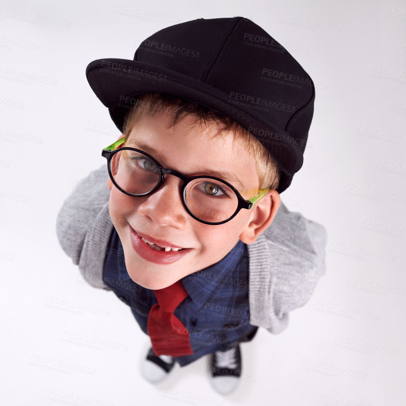 Buy stock photo Glasses, smile and portrait of child in studio for eye care, vision and optical health. Happy, optometry and top view of young boy kid with stylish eyewear or spectacles isolated by gray background.