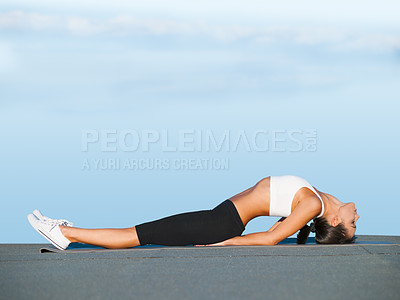 Buy stock photo Stretching, back and woman outdoor with yoga, exercise and holistic workout on ground. Summer, pilates and person on floor for mobility and flexibility of spine muscle with routine on blue sky