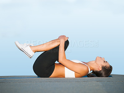 Buy stock photo Fitness, yoga and woman on floor in studio for body workout, stretching and balance for muscle. Zen, exercise and girl on ground for healthy training on blue background with focus, wellness and care