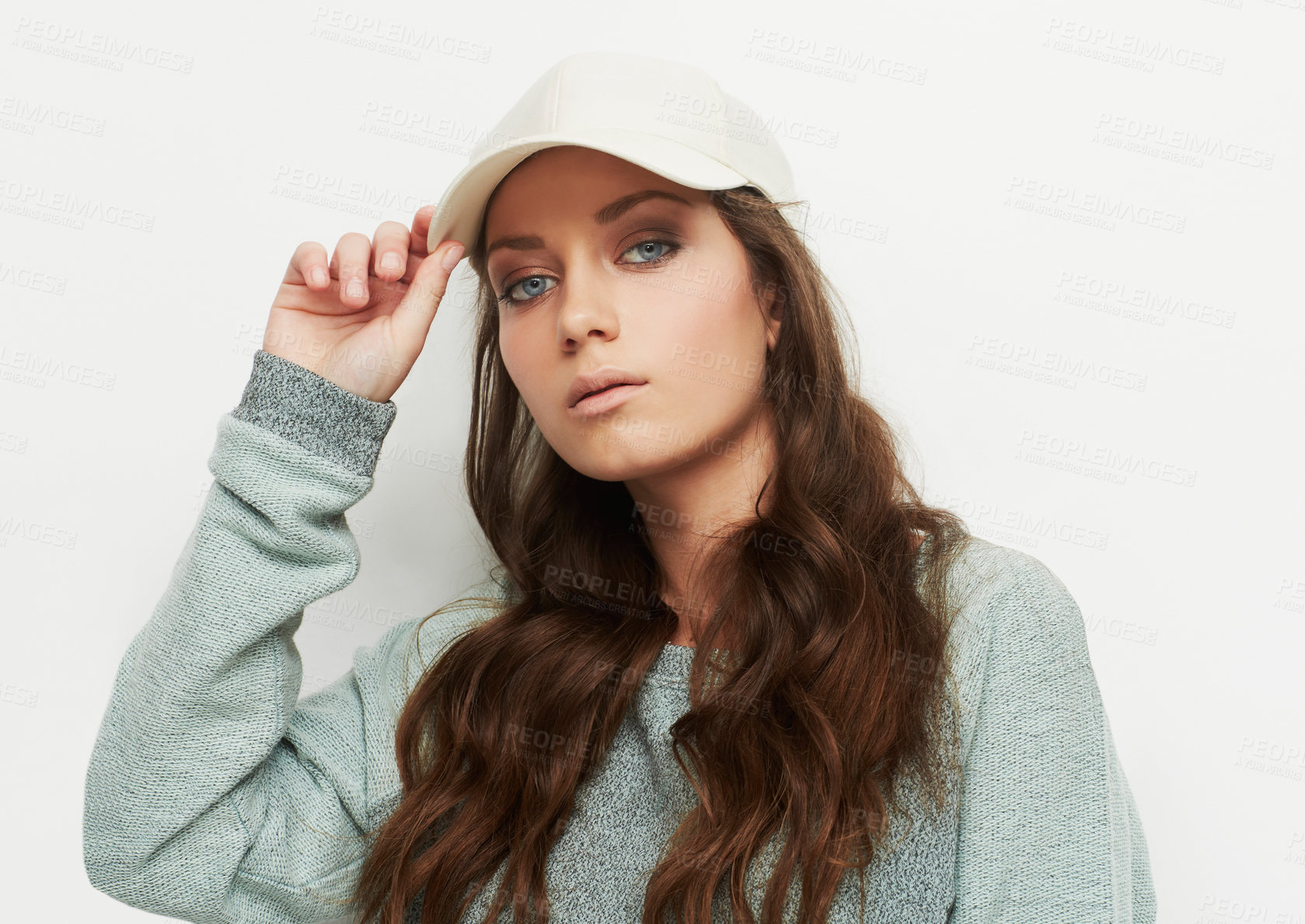 Buy stock photo Fashion, portrait and woman with a cap in studio with attitude, confidence or casual style on white background. Trendy, face and female model in cool, edgy or streetwear clothes or outfit choice 