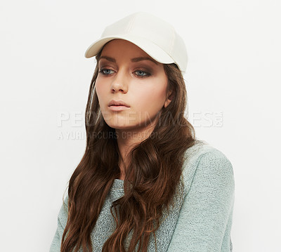 Buy stock photo Studio shot of a young woman wearing urban fashion against a gray background