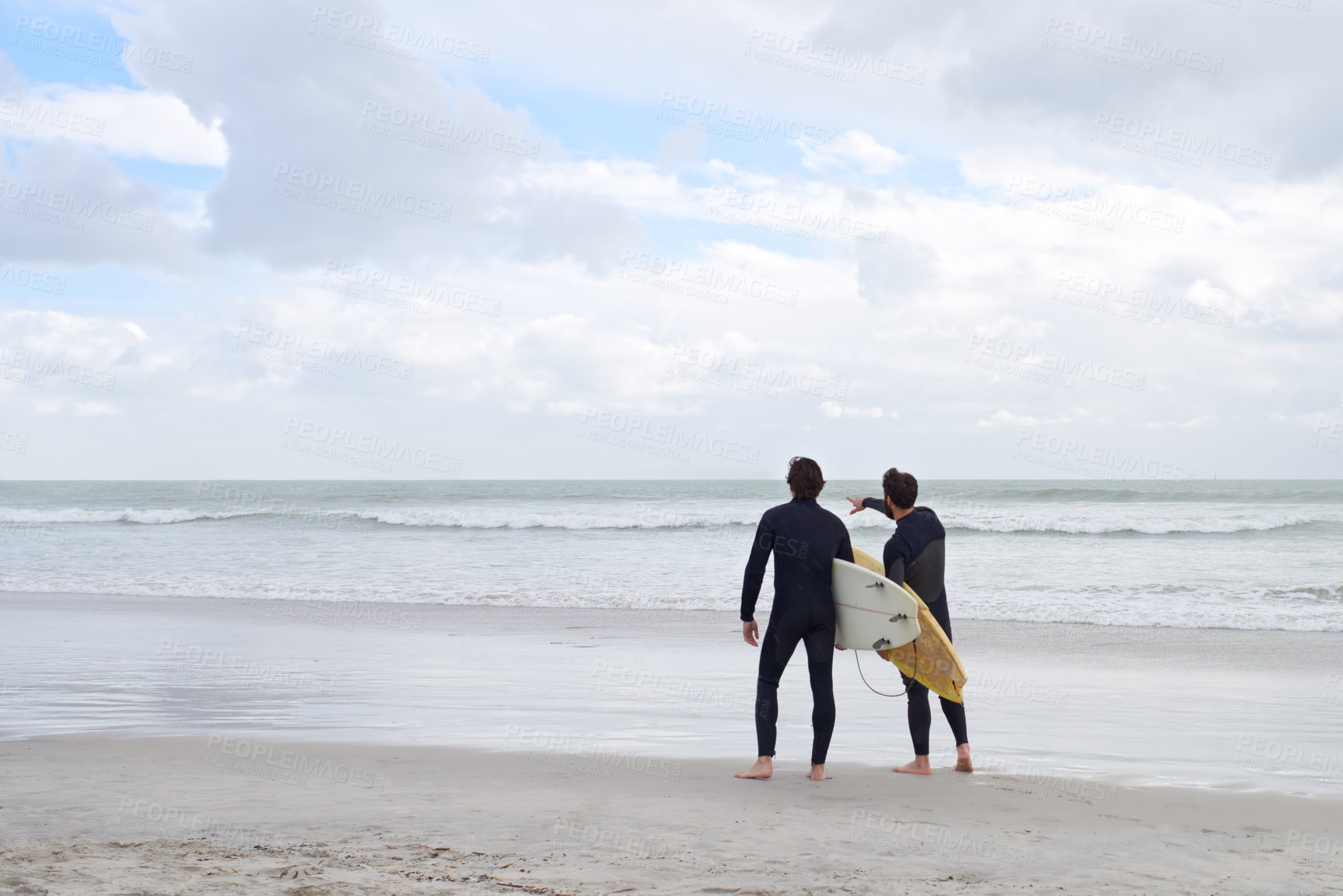 Buy stock photo Two young surfers on the beach