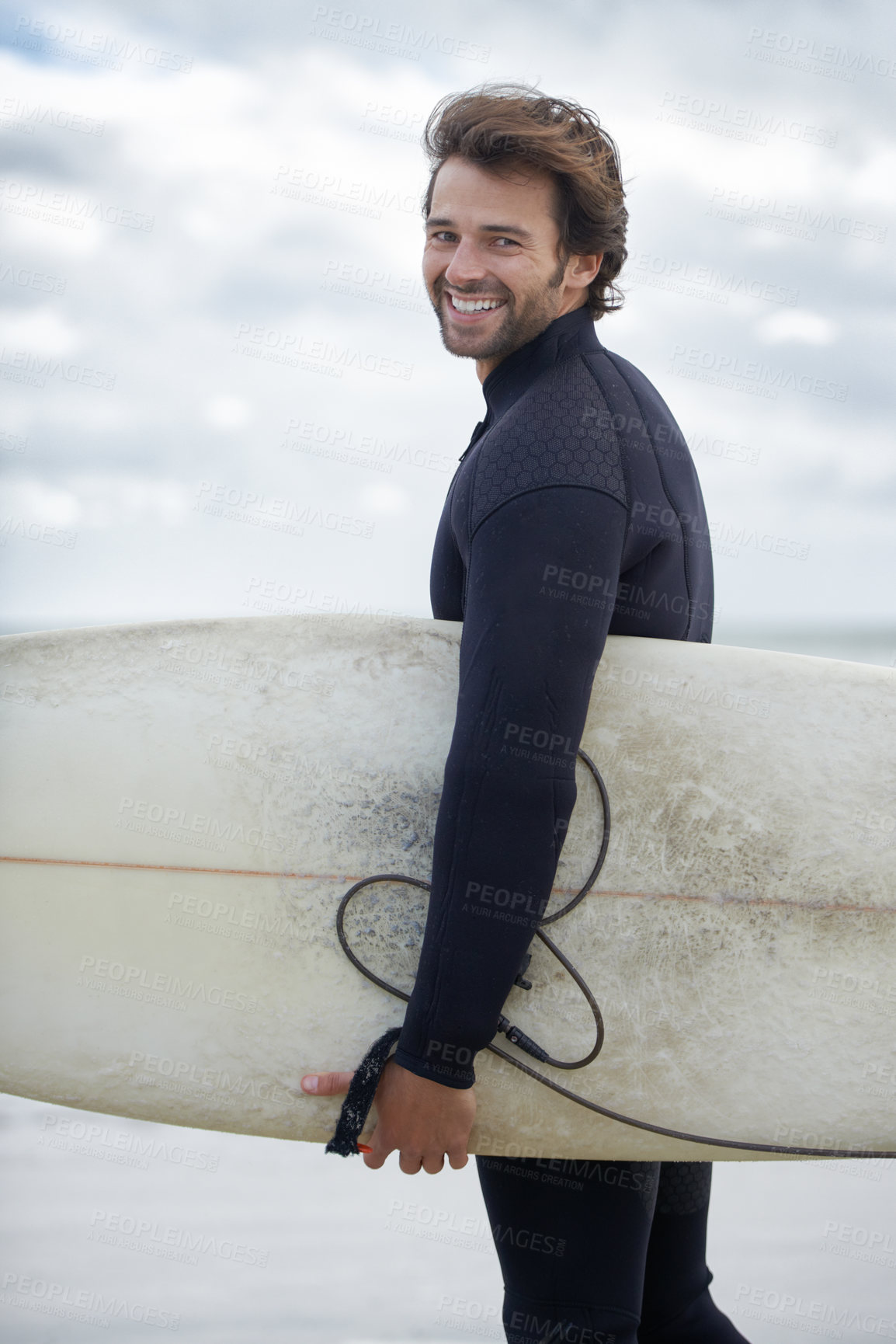 Buy stock photo Happy man, portrait and surfer on beach for exercise, sport or waves on shore in outdoor fitness. Young male person with smile and surfboard for surfing hobby on ocean coast, sea or water in nature