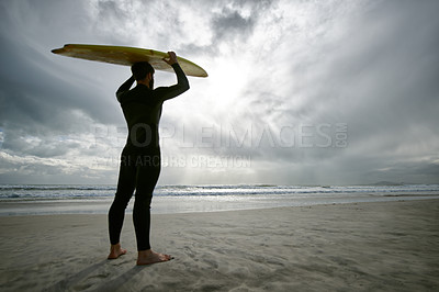 Buy stock photo Man, surfer and wetsuit at beach for waves, sport or exercise on sandy shore in outdoor fitness. Rear view of male person or athlete with surfboard for surfing on ocean coast, sea or water in nature
