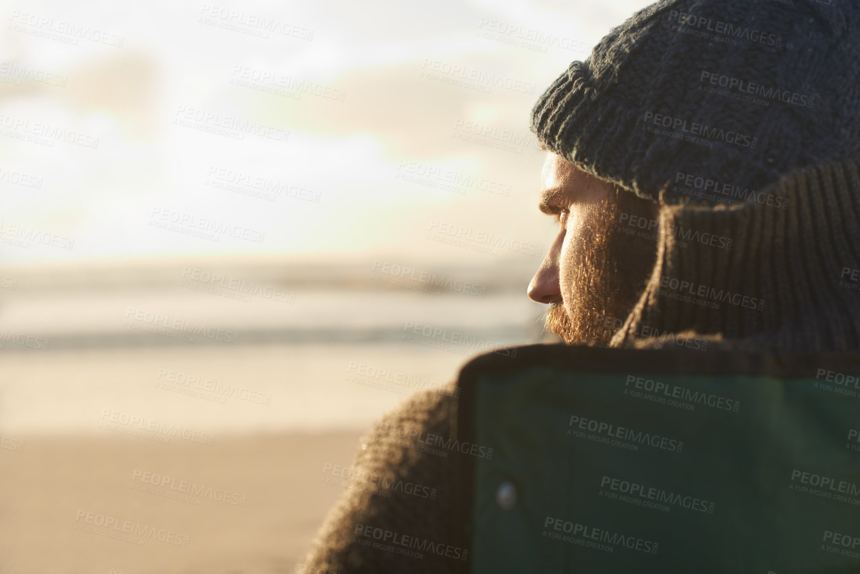 Buy stock photo Face, thinking and man at beach at sunset to relax on holiday or vacation for travel in summer. Nature, sunshine and view with young person on coast by sea or ocean for peace and quiet from back