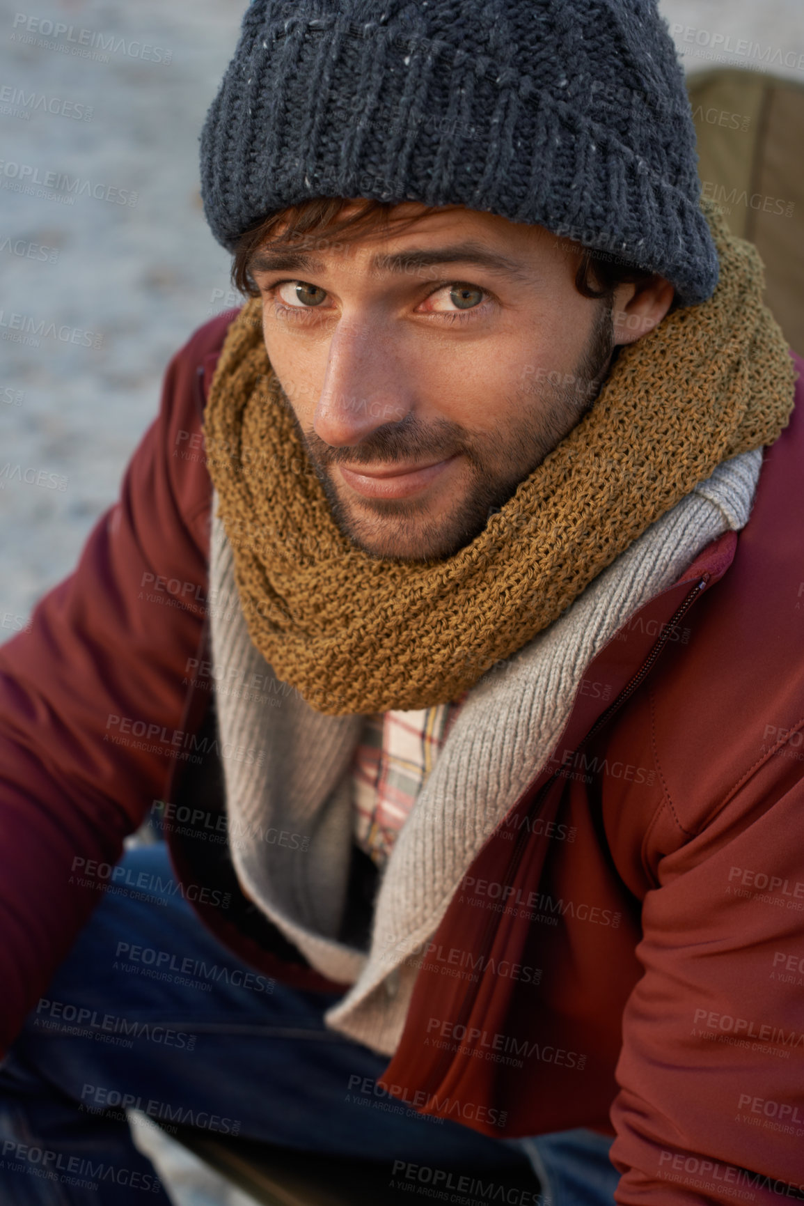 Buy stock photo Portrait, fashion and hipster man at beach on winter morning for travel, holiday or vacation. Face, coast or shore with confident young person in beanie and scarf accessories for cold weather season