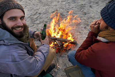 Buy stock photo Campfire, friends and portrait with man and smile by the beach with vacation and camping. Ocean, outdoor and together with travel and people on a trip and journey with fire conversation by sea