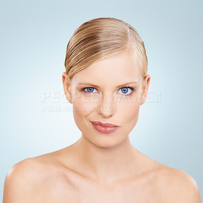 Buy stock photo Portrait, beauty and funny face with natural woman in studio on blue background for wellness or cosmetics. Skincare, facial and makeup with confident young model at spa for dermatology or comedy