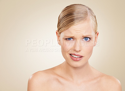 Buy stock photo Portrait, doubt and space for beauty with woman in studio on beige background to question wellness. Confused, skincare and funny face for problem on mockup with young model at spa for dermatology