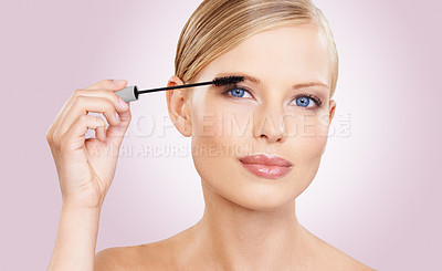 Buy stock photo Beauty, mascara and portrait of girl in studio with confidence, makeup for lashes or facial glow. Glamour, cosmetics and face of woman on pink background with healthy skin shine, brush and wellness.