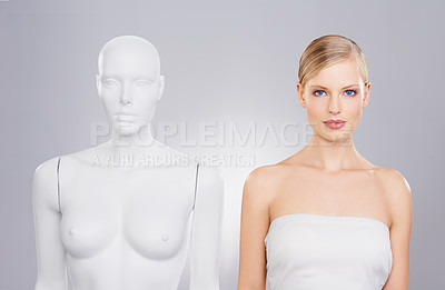 Buy stock photo Stunning blonde female standing next to a mannequin