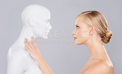 Buy stock photo Studio, woman and mannequin with perfect beauty versus fake standard, identity and facial wellness. Girl, doll and face in profile for cosmetics, plastic surgery or makeup on grey background.