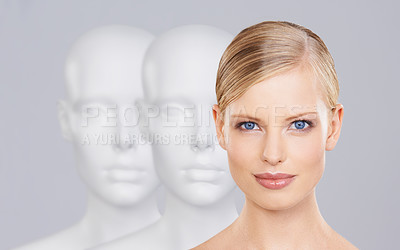 Buy stock photo Woman, mannequins and face for identity, beauty and individuality on studio background. Person, skincare and dummy with portrait for creativity and cosmetics or unique ideas for satisfaction and skin