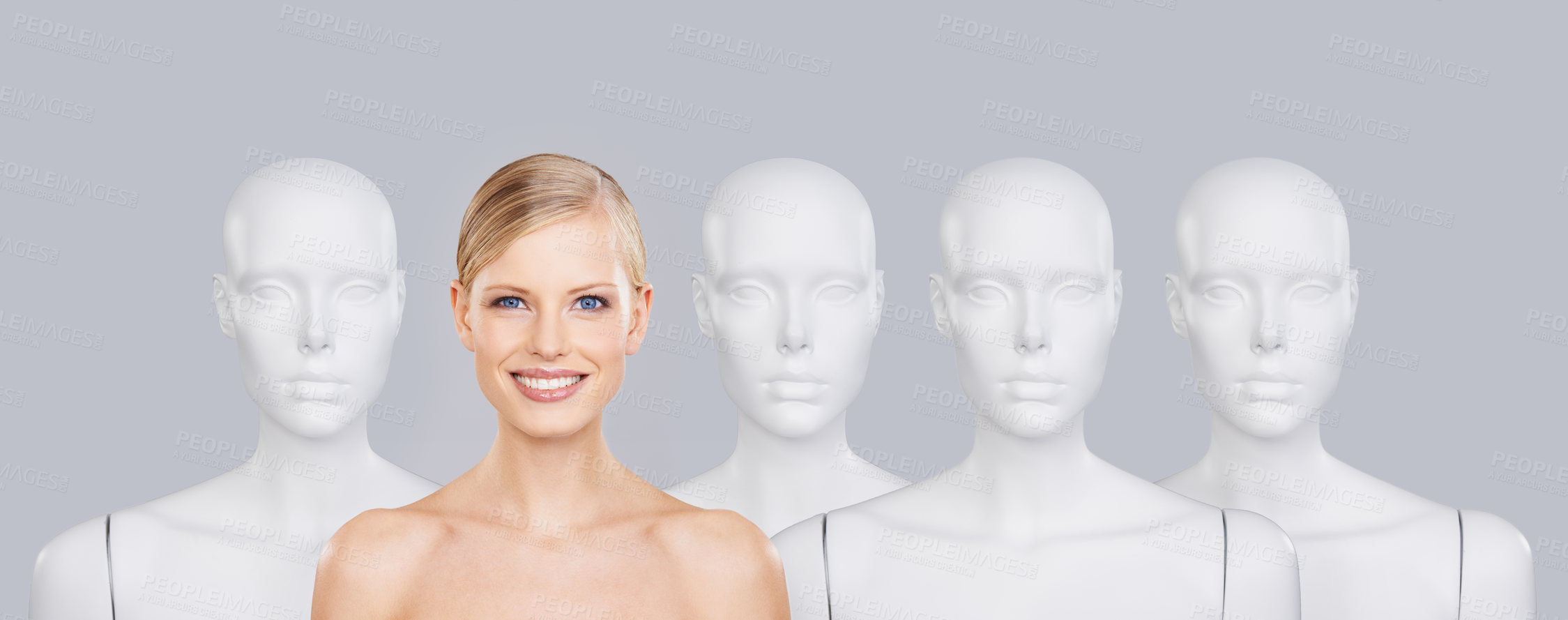 Buy stock photo Woman, mannequins and smile for identity, beauty and individuality on studio background. Person, skincare and dummy with face for creativity and cosmetics or unique ideas for satisfaction and skin