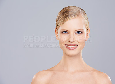 Buy stock photo Woman, face and smile for natural beauty, dermatology and wellness with cosmetic care on grey background. Facial, glow and portrait of happy model, headshot for clean skincare and shine in studio
