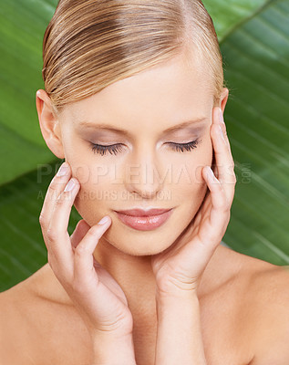 Buy stock photo Beauty, skincare and touching face with leaf background for wellness, natural and plant for smooth feel. Woman, cosmetic and dermatology for facial, routine and self care for healthy aesthetic skin