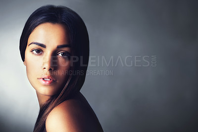Buy stock photo Shot of a beautiful young woman in the studio
