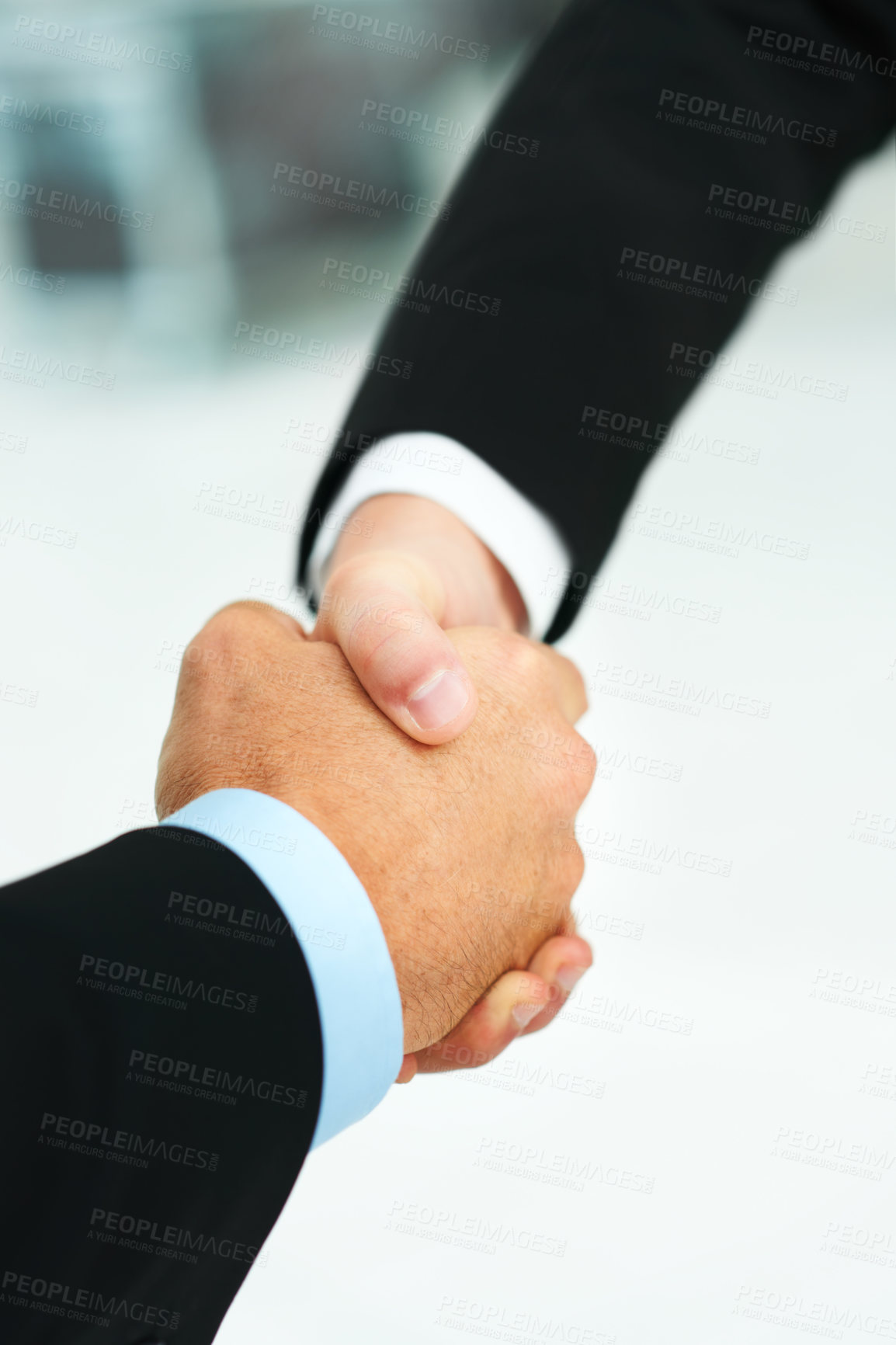 Buy stock photo Cropped shot of two businessmen shaking hands