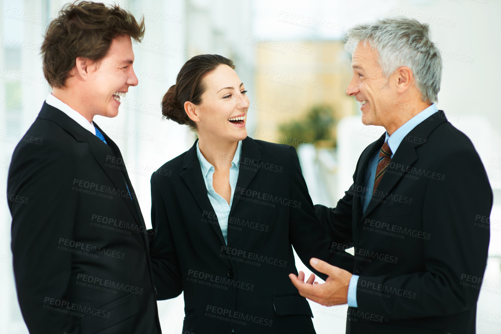 Buy stock photo Team, laugh and together in workplace of corporate company with professional suits talking to boss. CEO, happy and discussion with employees in meeting of collaboration in workforce for business