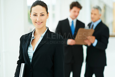 Buy stock photo Girl, portrait and team in background of workplace  with smile for business of corporate company. Person, happy and  professional as employee with suit and collaboration with leader to work for job