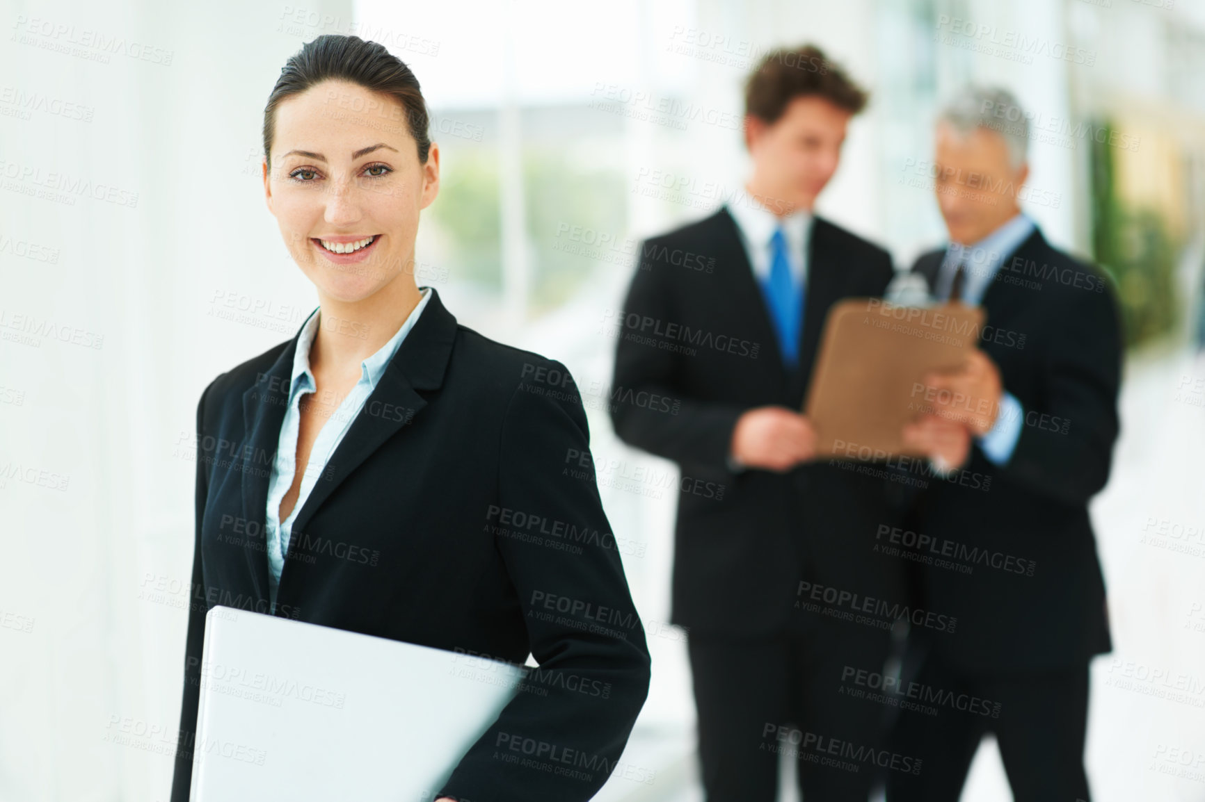 Buy stock photo Professional, woman and portrait in company with laptop and team in lobby of London office. Happy, person and business people in workplace with report, checklist and collaboration on project 
