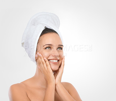 Buy stock photo Portrait, woman and hands for moisturizing skincare with smile, head towel and white background. Mockup of female person, glow and natural makeup for self care, spa treatment and flawless skin